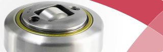 Metal combination bearing with integrated idler roller and yellow sealing detail, red design accent